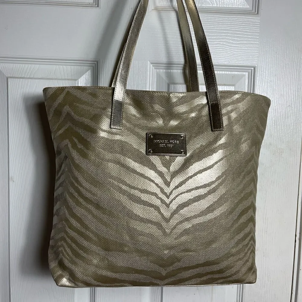 Michael Kors Metallic gold zebra print large tote gold tone hardwares and straps